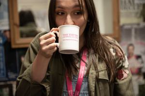 Staff member drinking tea