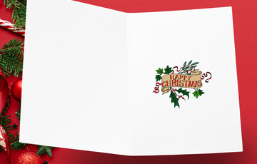 Inside of greetings card. Red font on a scroll reading Happy Christmas, surrounded by greenery and red ribbons.