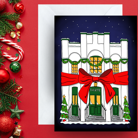 Image of The Theatre on dark background with snow falling around it. Big red bow tied around the building and Christmas trees on either side.