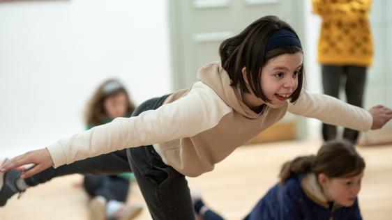 Girl balancing on one leg
