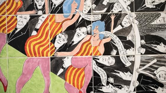 hotograph of an offset tile moasiac of pantomime mosaic