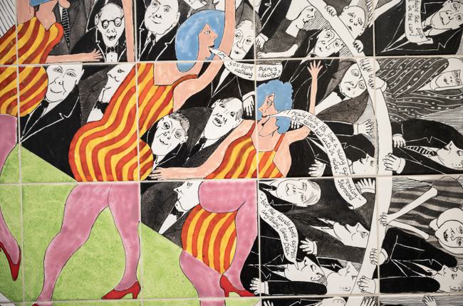 hotograph of an offset tile moasiac of pantomime mosaic