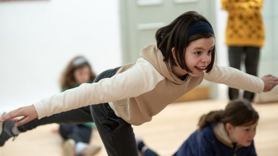 Girl balancing on one leg