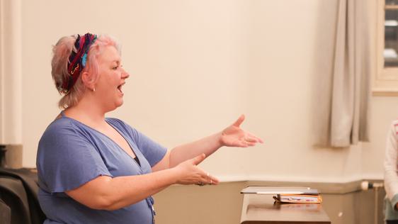 Choir leader conducting singers
