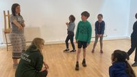 Group playing a drama game as part of a workshop