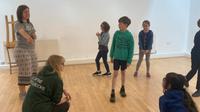 Group playing a drama game as part of a workshop