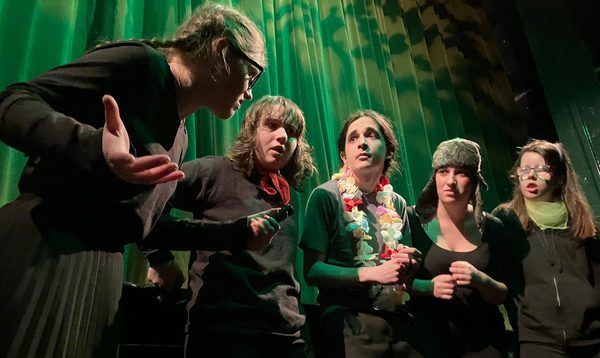 A group of teenagers reenacting the members of the Mystery Machine gang.