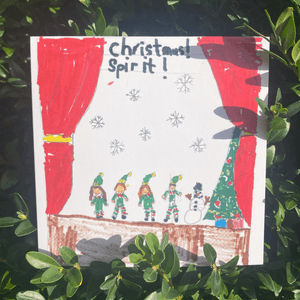 Christmas card with an illustration of elves and a snowman on a stage